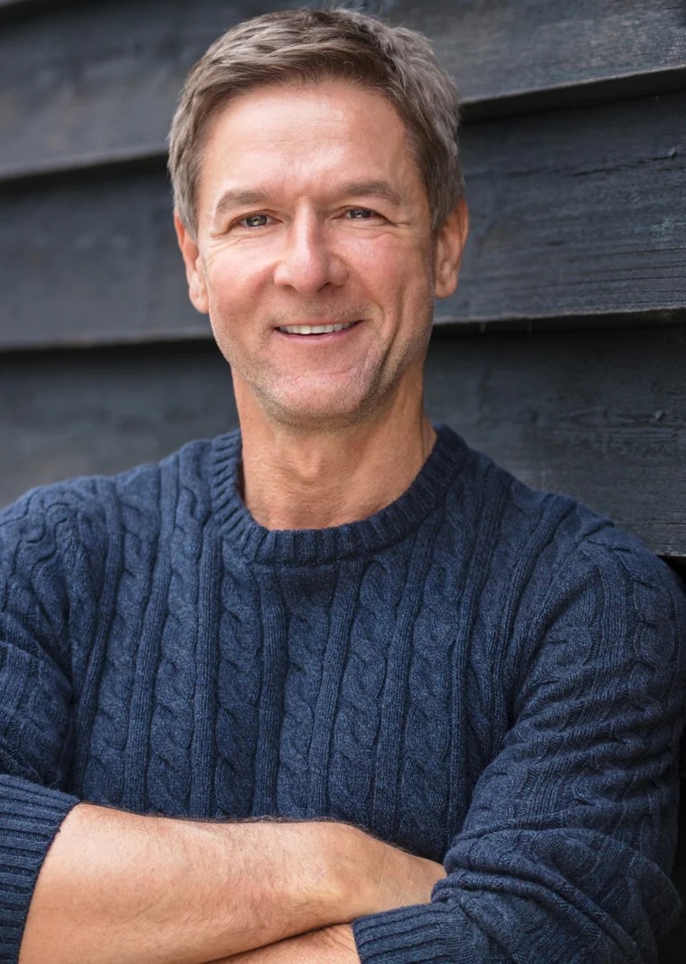 Smiling man after laser eye surgery.
